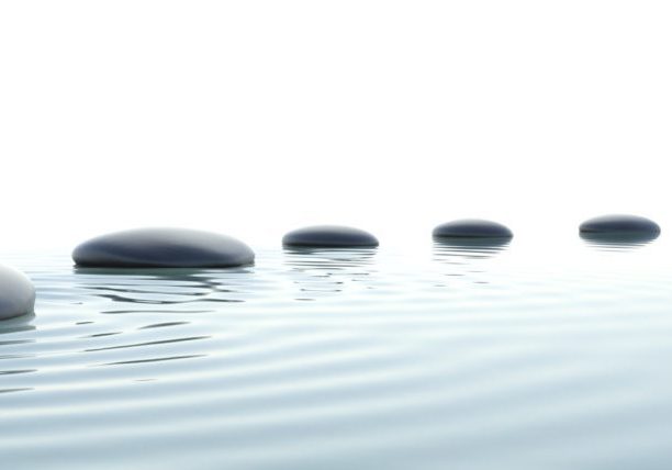 Zen stones in water on widescreen with white background